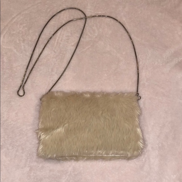 white fluffy clutch bag